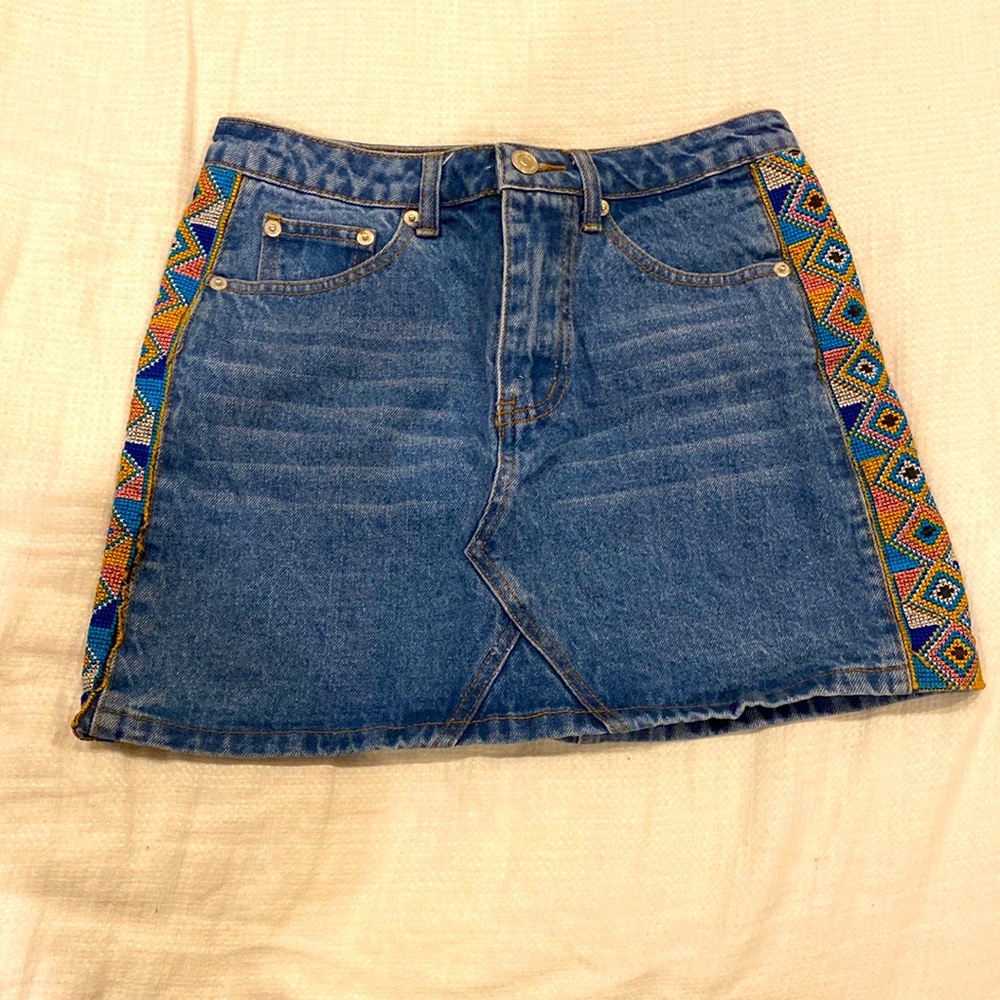 Jean denim skirt with embroidered edges
